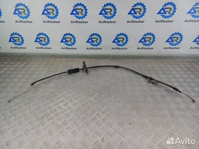 Трос стояночного тормоза левый Land Rover