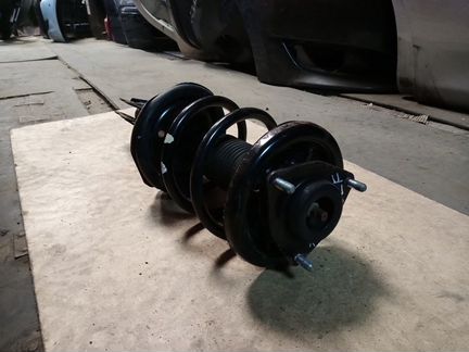 Передний амортизатор левый Mitsubishi Outlander XL